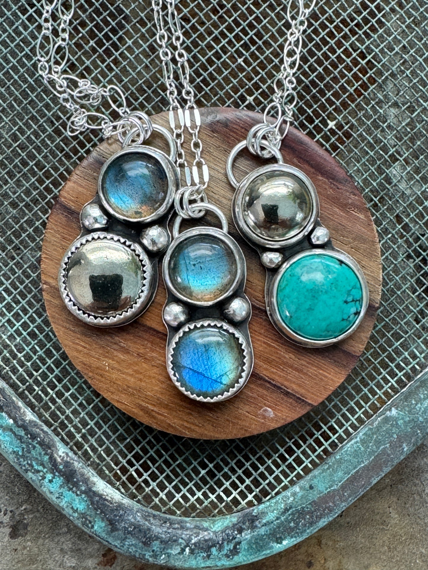 Double gemstone necklaces with sterling silver chain on a display