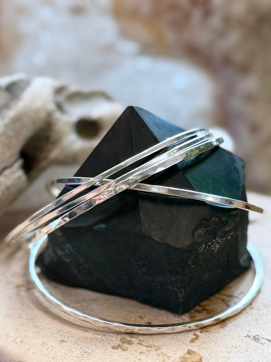 Sterling silver bangle bracelets in hammered and plain handmade by Wildstone Silver