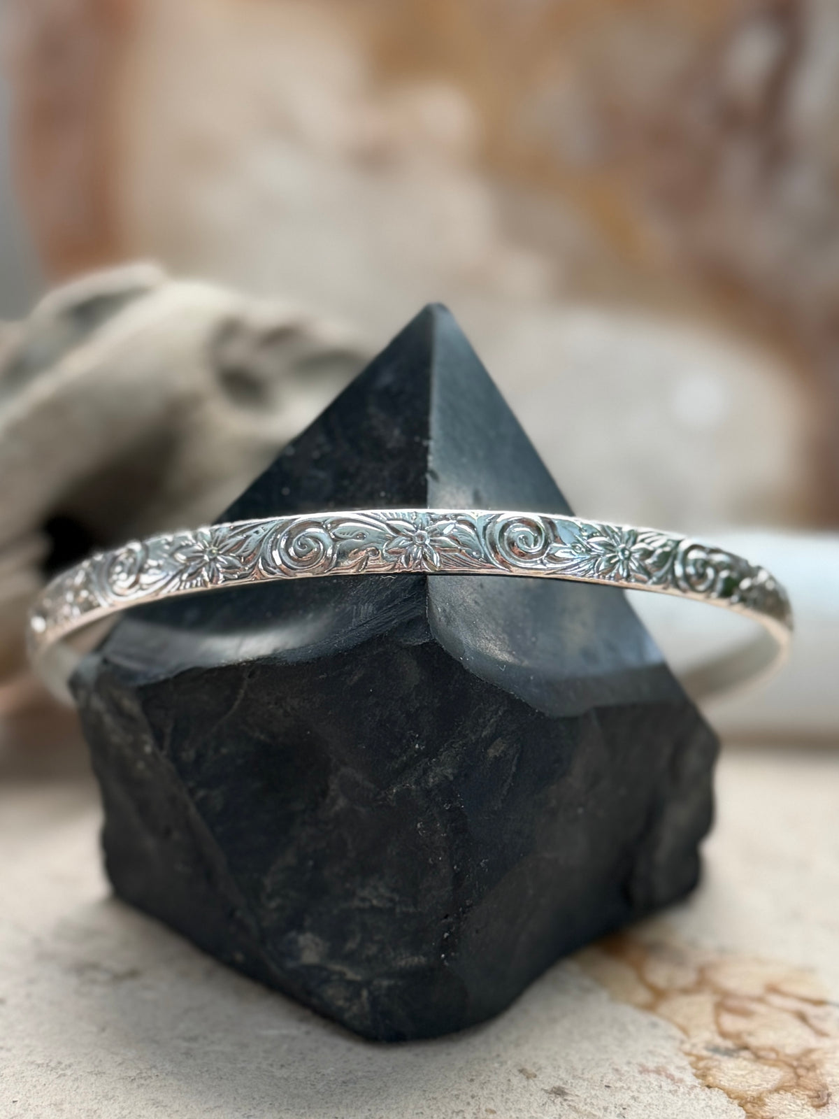 Close-up of Sterling silver floral bracelet handmade by Wildstone Silve